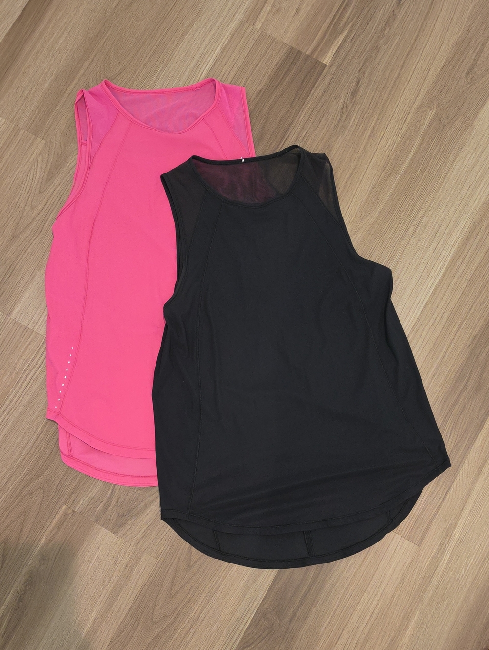 Pair Of Lululemon Women’s Athletic Tank Top - Black and Hot Pink.